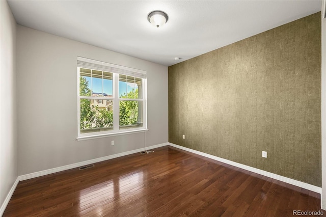 19782 W 59th Ave, Golden, CO 80403 - empty room featuring dark wood finished floors and baseboards