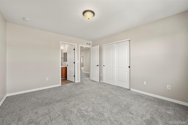 19782 W 59th Ave, Golden, CO 80403 - unfurnished bedroom with carpet floors, baseboards, a closet, and ensuite bathroom