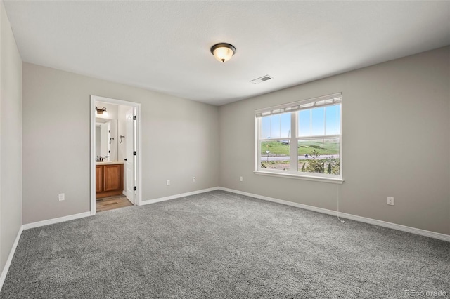 19782 W 59th Ave, Golden, CO 80403 - unfurnished bedroom with carpet, baseboards, and connected bathroom