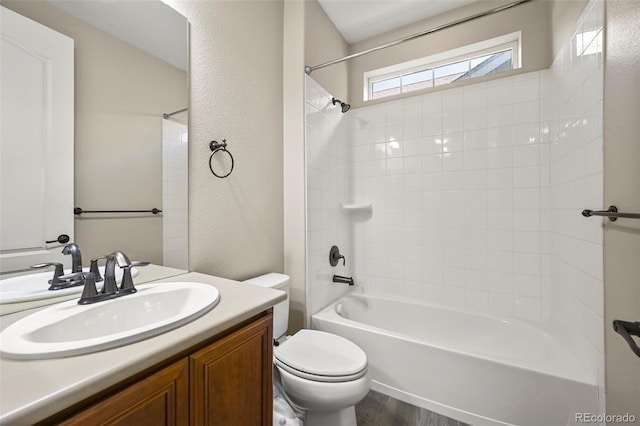 19782 W 59th Ave, Golden, CO 80403 - full bathroom with toilet, vanity, shower / bathtub combination, wood finished floors, and a textured wall