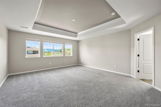 19782 W 59th Ave, Golden, CO 80403 - unfurnished room with a tray ceiling, carpet flooring, ornamental molding, baseboards, and a smoke detector