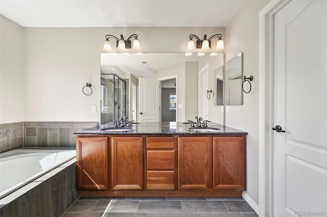 19782 W 59th Ave, Golden, CO 80403 - bathroom featuring double vanity, a garden tub, and a shower with shower door