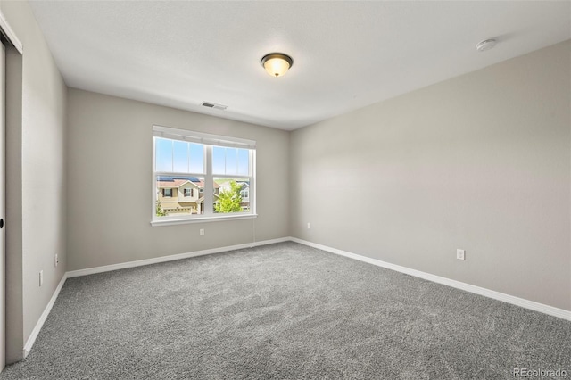 19782 W 59th Ave, Golden, CO 80403 - empty room with a smoke detector, carpet, and baseboards