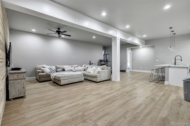 7668 Buckskin Ranch Vw, Peyton, CO 80831 - living area with light wood-style floors, ceiling fan, baseboards, visible vents, and recessed lighting
