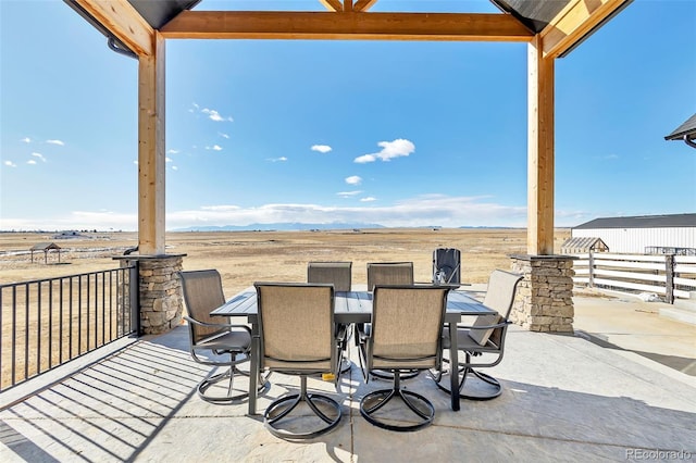 7668 Buckskin Ranch Vw, Peyton, CO 80831 - view of patio / terrace with outdoor dining space and fence