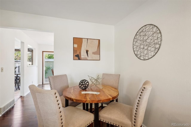 dining area with dark hardwood / wood-style floors