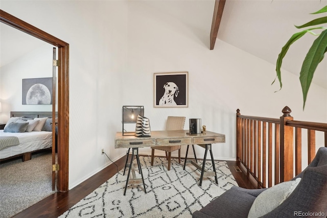 home office with lofted ceiling with beams and dark hardwood / wood-style flooring