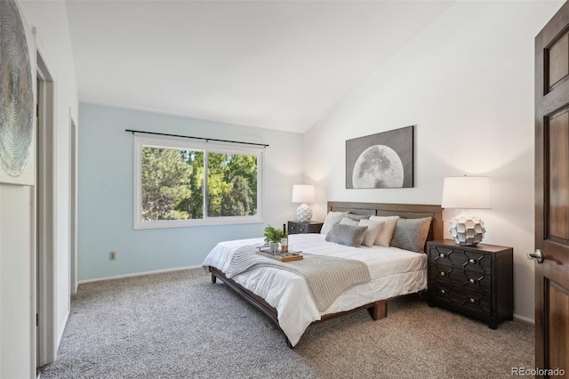 carpeted bedroom with vaulted ceiling