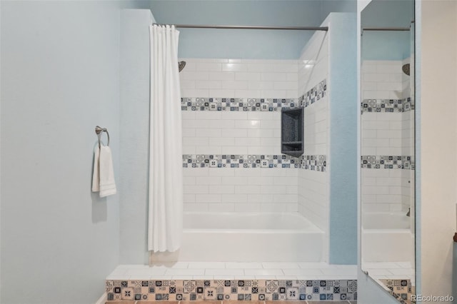 bathroom featuring shower / tub combo with curtain