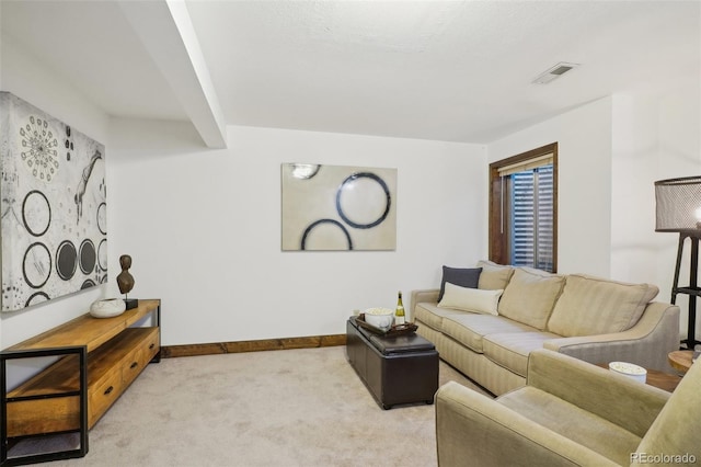 living room with light carpet and beam ceiling