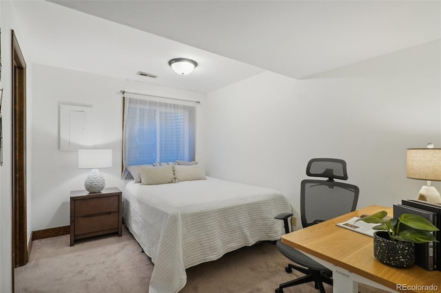 bedroom featuring light carpet