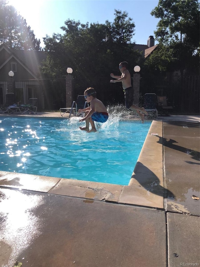 view of pool with a water slide