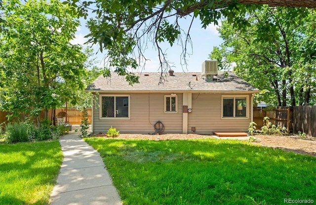 5584 S Datura St, Littleton, CO 80120 - rear view of property with a fenced backyard, a chimney, and roof with shingles