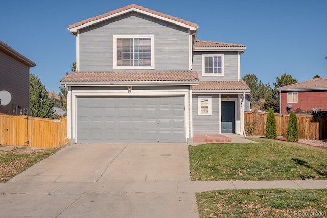 view of property with a garage and a front yard