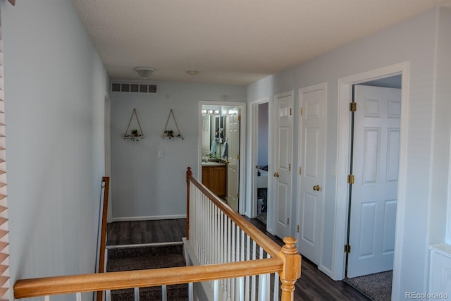 stairs featuring hardwood / wood-style flooring