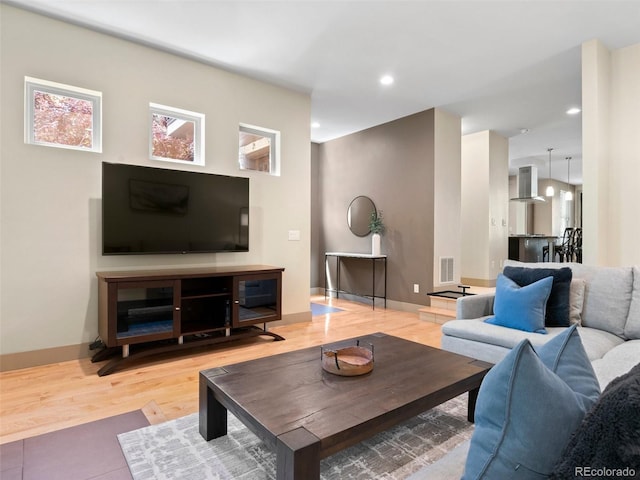 2741 Java Ct, Denver, CO 80211 - living area with wood finished floors, recessed lighting, and baseboards
