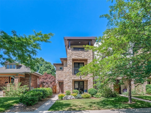 2741 Java Ct, Denver, CO 80211 - contemporary home with stone siding, a balcony, and a front yard