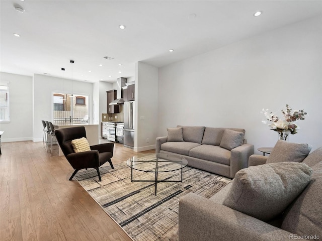 living room with light hardwood / wood-style flooring