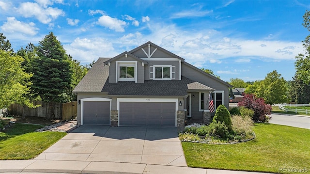 7696 S Hudson Way, Centennial, CO 80122 - craftsman-style house with stone siding, driveway, a garage, a shingled roof, and an attached garage