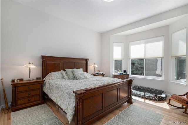 7696 S Hudson Way, Centennial, CO 80122 - bedroom featuring light wood-style flooring and baseboards