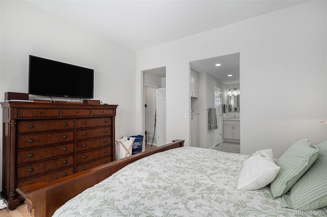 7696 S Hudson Way, Centennial, CO 80122 - bedroom with ensuite bathroom and recessed lighting