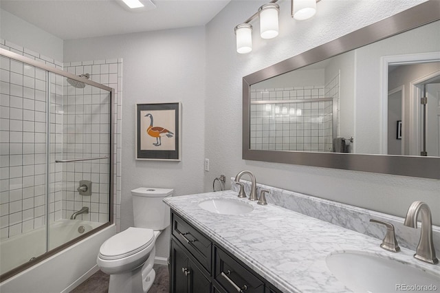 7696 S Hudson Way, Centennial, CO 80122 - full bath featuring double vanity, enclosed tub / shower combo, and toilet