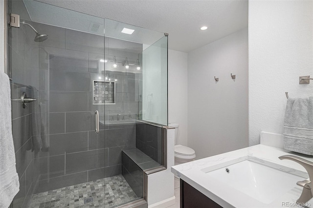 7696 S Hudson Way, Centennial, CO 80122 - bathroom featuring vanity, a shower stall, and toilet