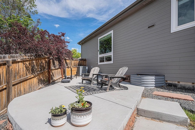 7696 S Hudson Way, Centennial, CO 80122 - fenced backyard featuring a patio area and central AC unit