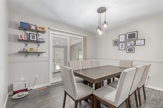 1371 W 133rd Way, Denver, CO 80234 - dining area featuring wood finished floors and baseboards