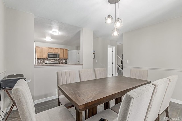 1371 W 133rd Way, Denver, CO 80234 - dining area with dark wood-style floors and stairway