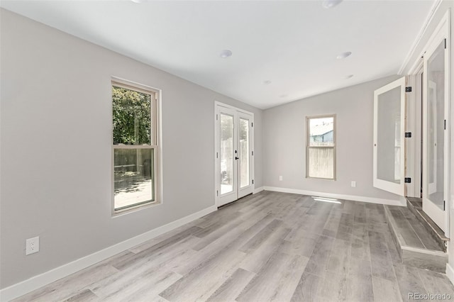 1371 W 133rd Way, Denver, CO 80234 - spare room featuring plenty of natural light, wood finished floors, and french doors