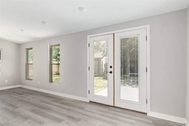 1371 W 133rd Way, Denver, CO 80234 - doorway to outside featuring light wood-type flooring and french doors