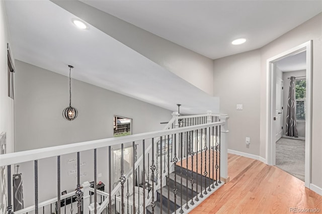 1371 W 133rd Way, Denver, CO 80234 - corridor featuring wood finished floors, recessed lighting, an upstairs landing, and lofted ceiling