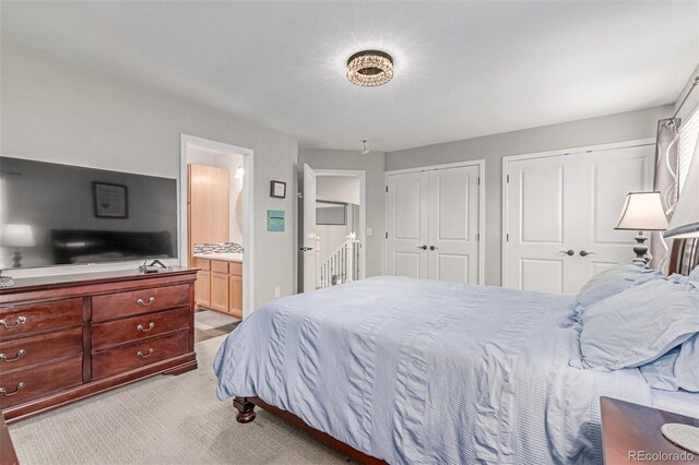 1371 W 133rd Way, Denver, CO 80234 - bedroom with multiple closets, light colored carpet, and connected bathroom