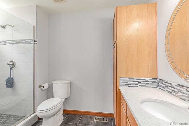 1371 W 133rd Way, Denver, CO 80234 - full bath featuring vanity, a stall shower, decorative backsplash, and tile patterned floors
