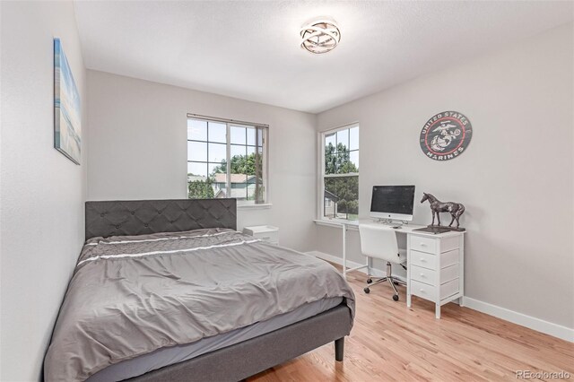 1371 W 133rd Way, Denver, CO 80234 - bedroom featuring light wood-type flooring and baseboards