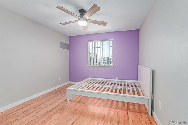 1371 W 133rd Way, Denver, CO 80234 - unfurnished bedroom with wood finished floors and ceiling fan