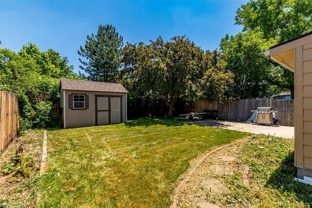 1371 W 133rd Way, Denver, CO 80234 - fenced backyard with a patio and a shed