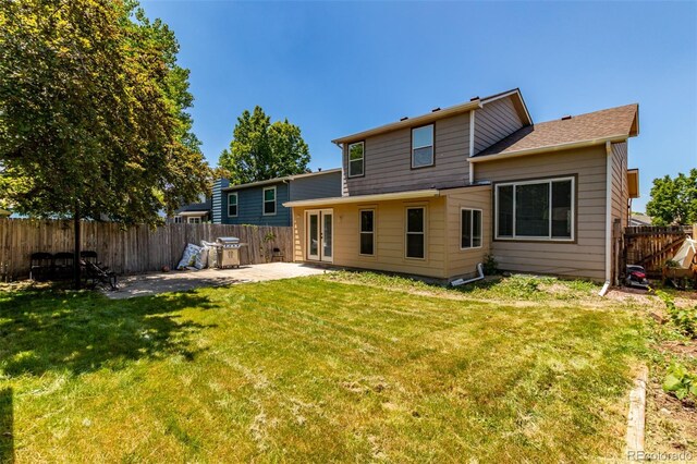 1371 W 133rd Way, Denver, CO 80234 - rear view of property with a patio area and a fenced backyard