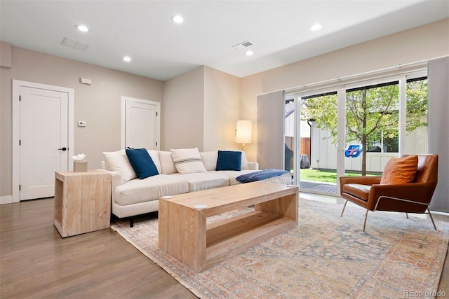 3103 S Cherokee St, Englewood, CO 80110 - living room with light wood-style flooring and recessed lighting