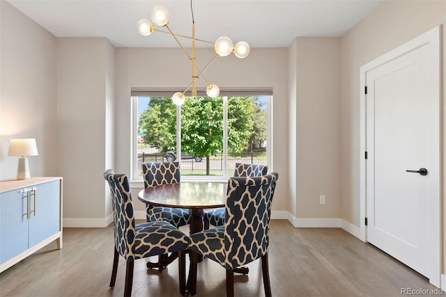 3103 S Cherokee St, Englewood, CO 80110 - dining space with wood finished floors and a chandelier
