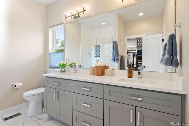 3103 S Cherokee St, Englewood, CO 80110 - full bath featuring vanity, a stall shower, a walk in closet, and marble look tile flooring