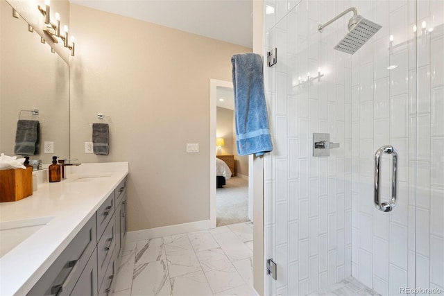 3103 S Cherokee St, Englewood, CO 80110 - ensuite bathroom featuring a shower stall, marble look tile flooring, and double vanity