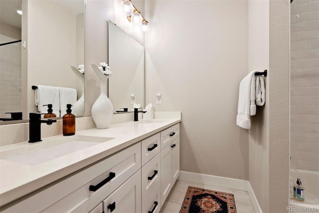 3103 S Cherokee St, Englewood, CO 80110 - full bathroom featuring double vanity and baseboards