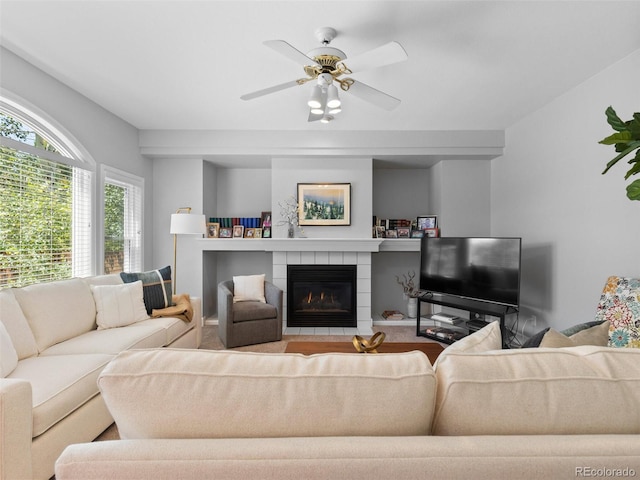 16362 Oakmoor Pl, Parker, CO 80134 - living area featuring a ceiling fan, a tiled fireplace, and carpet floors