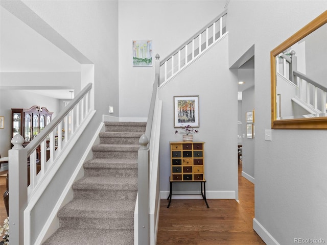 16362 Oakmoor Pl, Parker, CO 80134 - stairway featuring wood finished floors and a high ceiling