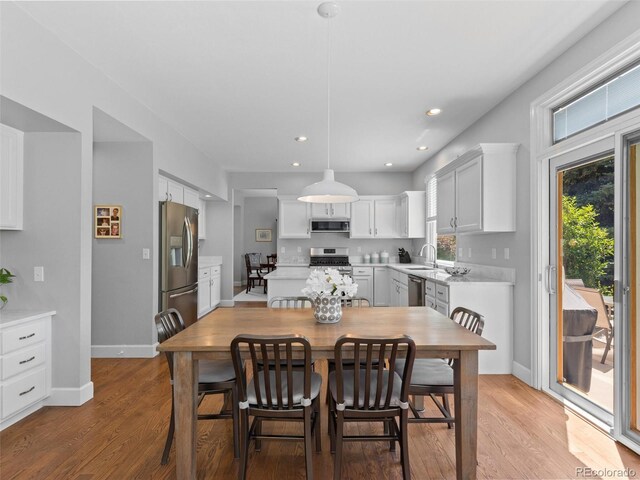 16362 Oakmoor Pl, Parker, CO 80134 - dining room featuring light wood-style flooring and recessed lighting