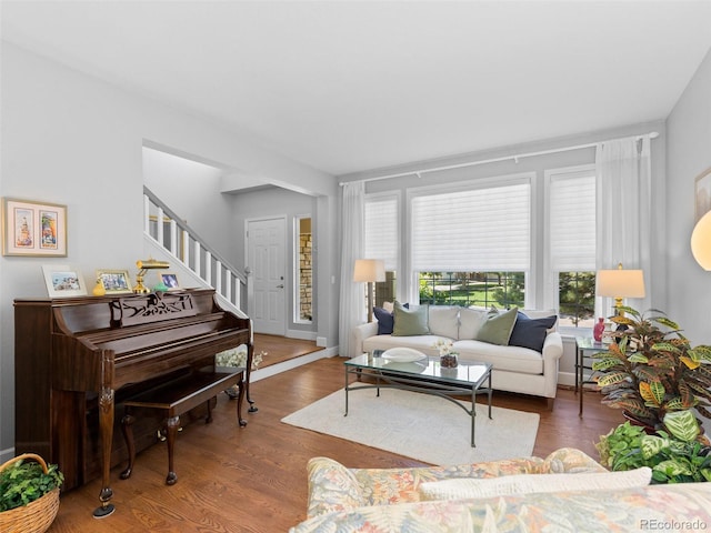 16362 Oakmoor Pl, Parker, CO 80134 - living area with plenty of natural light, wood finished floors, and stairway