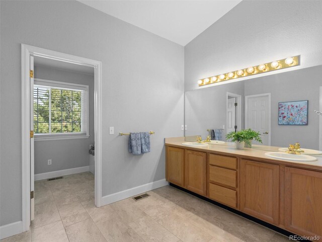 16362 Oakmoor Pl, Parker, CO 80134 - full bathroom featuring double vanity and lofted ceiling