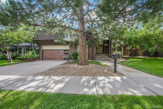 obstructed view of property featuring a front yard